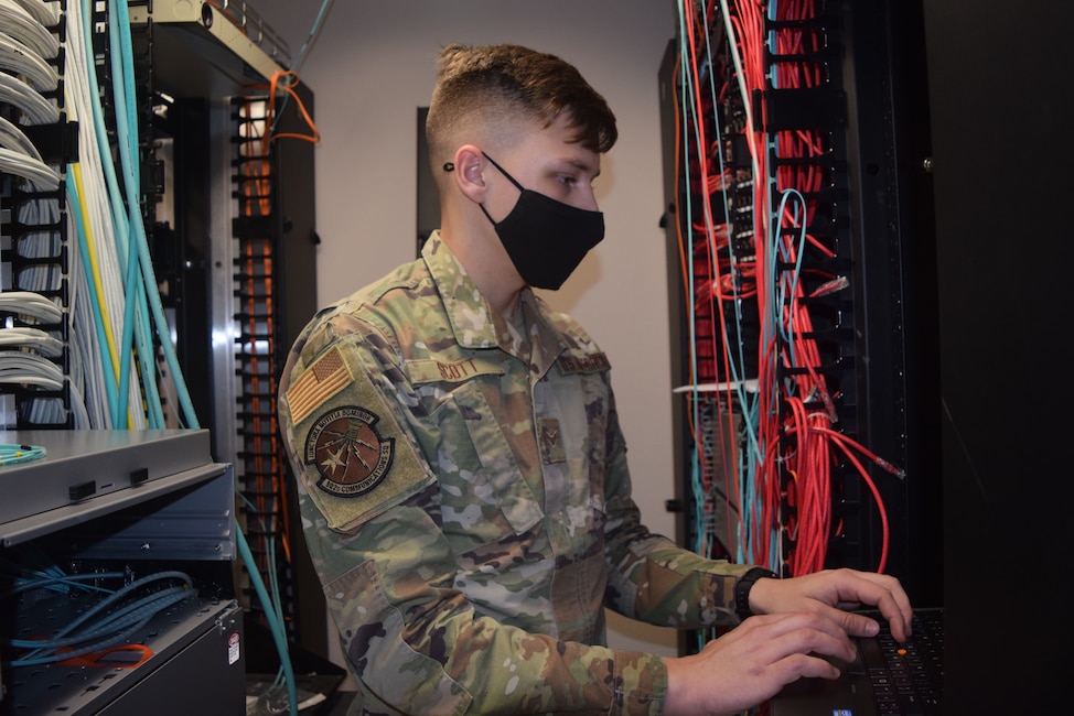 A1C Scott types on a keyboard at 16th Air Force (Air Forces Cyber).