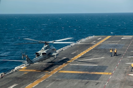 An AH-1Z Viper attached to Marine Attack Squadron (VMM) 214, 11th Marine Expeditionary Unit (MEU), takes off from the flight deck of the amphibious assault ship USS Essex (LHD 2), Jan. 12, 2022.