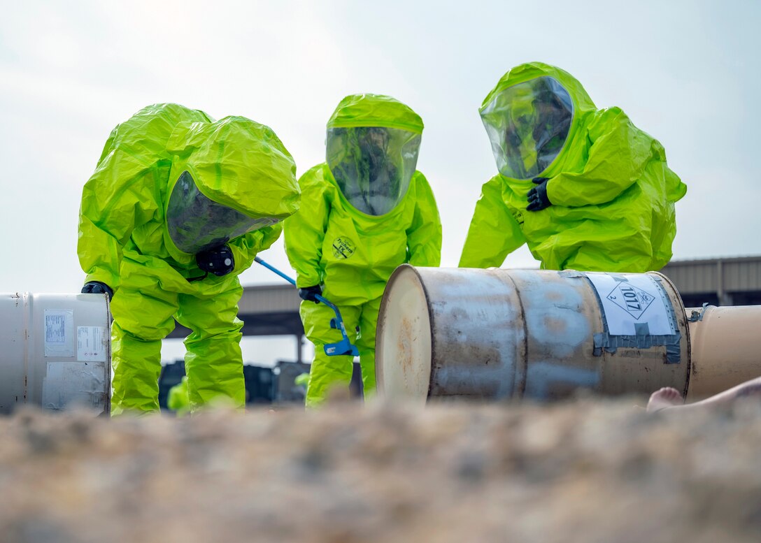 Firefighters evaluate a simulated chemical spill
