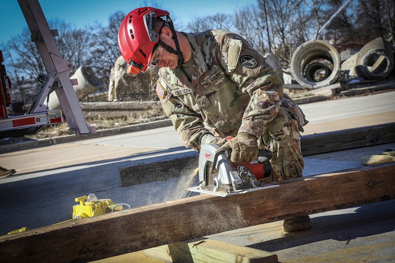 District of Columbia, (Jan 11, 2022) – U.S. Marines from Chemical Biological Incident Response Force (CBIRF) along with U.S. Army Soldiers from the 911th Technical Rescue Engineer Company participate in Joint technical rescue training using a trench trainer at the DC Fire Training Academy in Washington D.C. on January 11, 2022. CBIRF trains with various units and locations year-round in order to maintain maximum effectiveness for both the unit itself, and everyone else in the CBRNE mission set. Technical rescue is a vital component of CBRNE response, as Marines and Soldiers could potentially have to stabilize structures to provide aid. (Official U.S. Marine Corps photo by Gunnery Sgt. Kristian S. Karsten/Released)