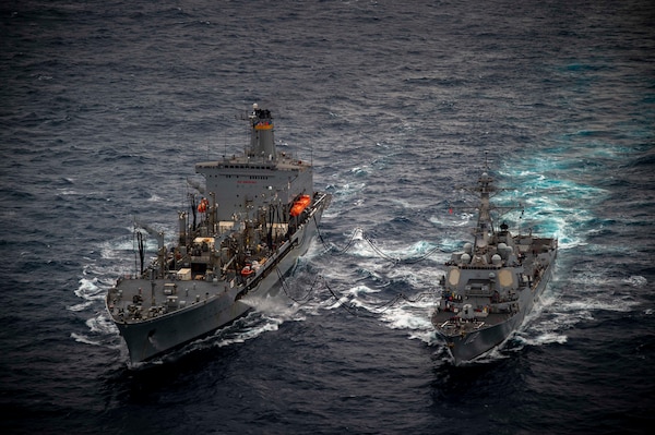 Henry J. Kaiser-class fleet replenishment oiler USNS John Ericsson (T-AO 194) conducts a replenishment-at-sea with Arleigh Burke-class guided-missile destroyer USS Michael Murphy (DDG 112) in the South China Sea, Jan. 13, 2022.
