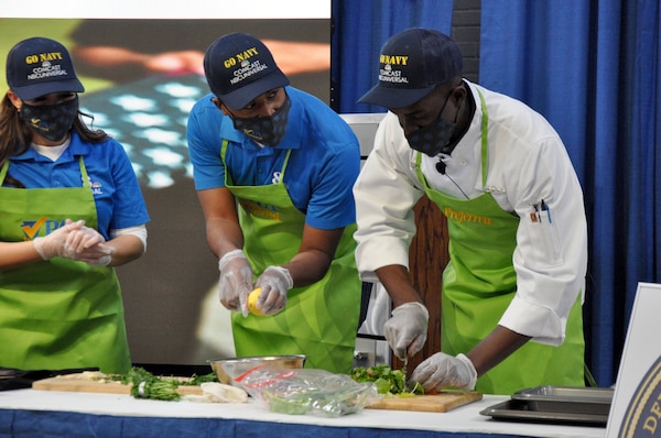 Operators monitor the live broadcast of the annual Army/Navy Cook-off at the Pennsylvania Farm Show in Harrisburg, Penn.