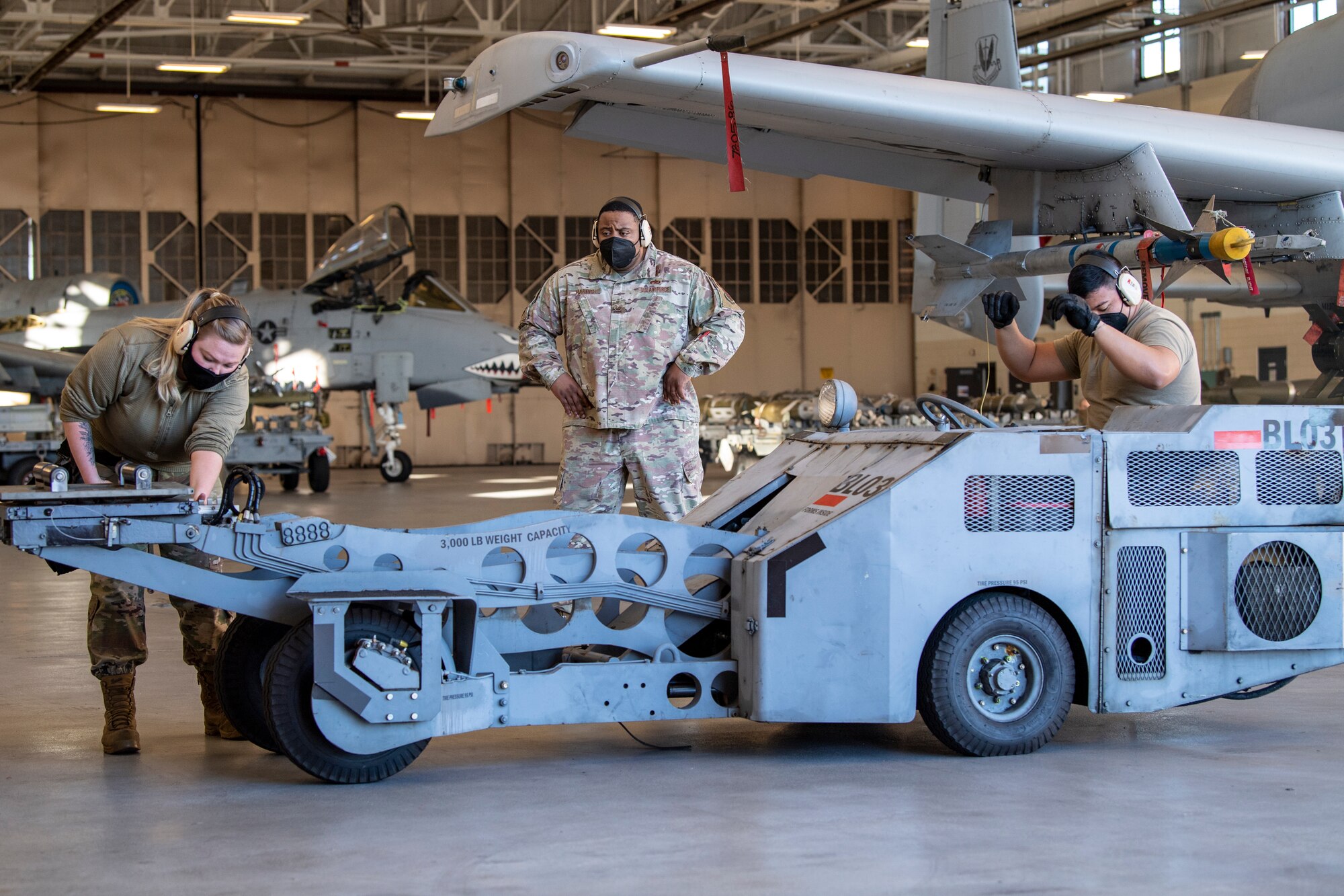 Photo of Airmen operating vehicle