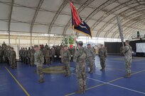 U.S. Army Soldiers with the 1-102nd Infantry Regiment (Mountain), Task Force Iron Gray and the 1-116th Infantry Regiment, Task Force Red Dragon, Combined Joint Task Force - Horn of Africa (CJTF-HOA), stand together during a transfer of authority ceremony, Jan. 8, 2022, at Camp Lemonnier, Djibouti.