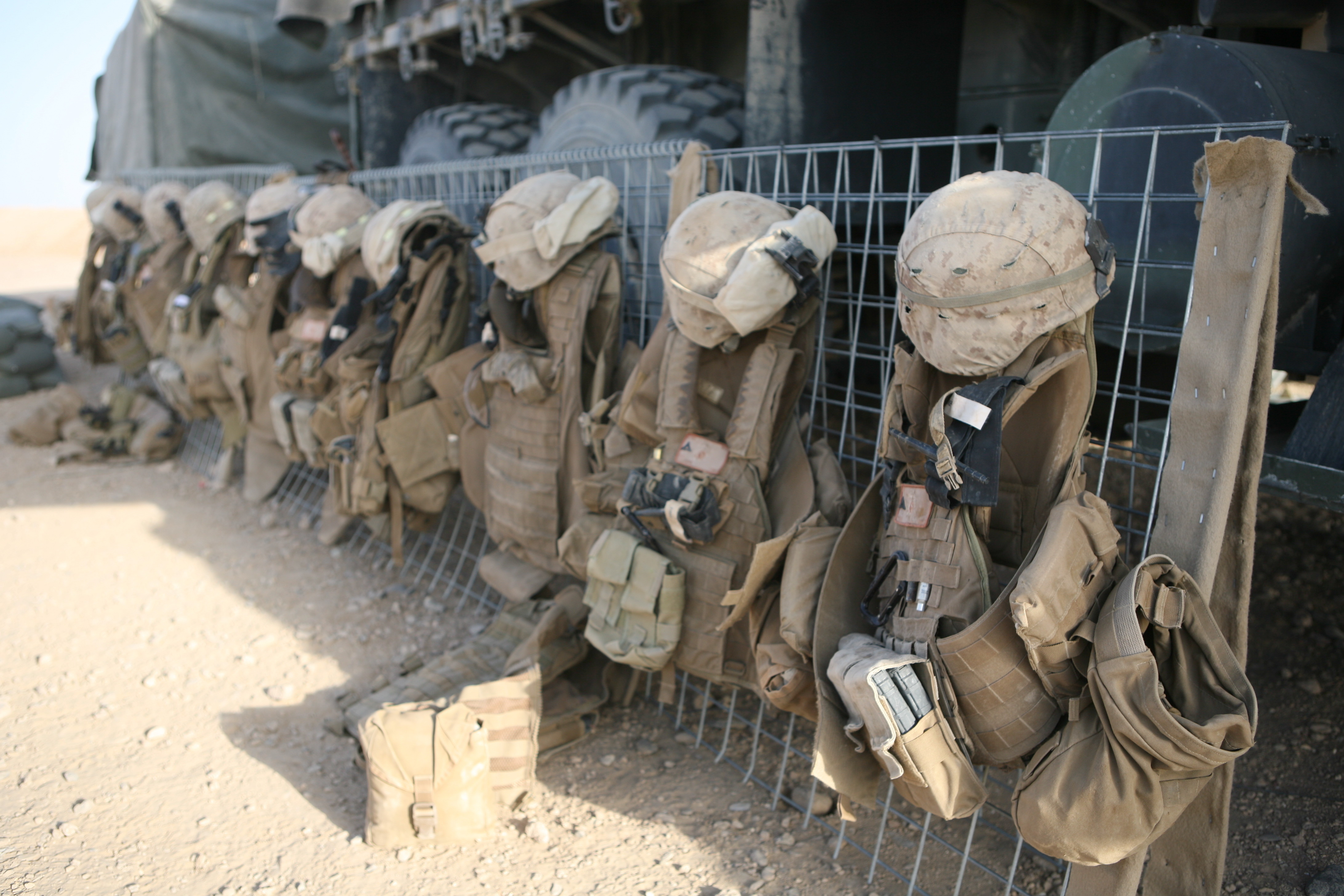 Marine equipment hanging on a truck in the desert.