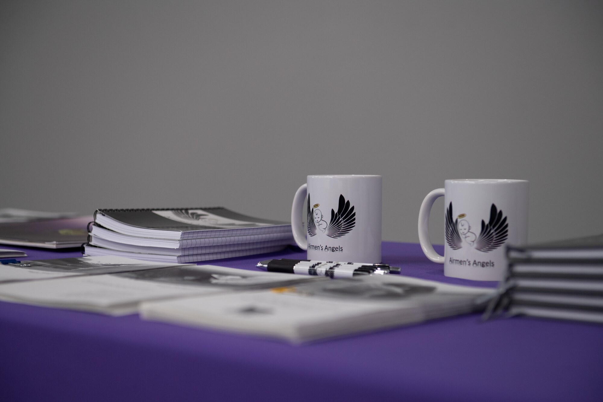 picture of journals, pens, and mugs