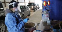 Wisconsin National Guard Citizen-Soldiers and -Airmen collect specimens for COVID-19 testing in 2021. Guard members will train as certified nursing assistants to support hospitals and nursing homes facing a surge in COVID-19 cases, Gov. Tony Evers announced Jan. 13, 2022.