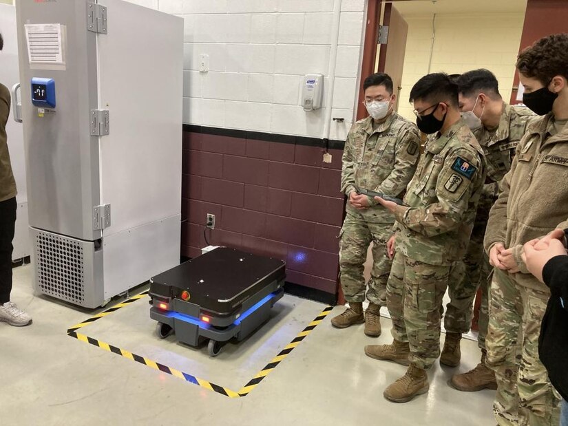 Soldiers at the U.S. Army Medical Materiel Center-Korea receive training on the operation of a new robotics carrier system put in use in the USAMMC-K warehouse. The system has increased efficiency and reduced manpower needs for processing orders for medical supply. (U.S. Army photo by Master Sgt. Rizmel Paguio)