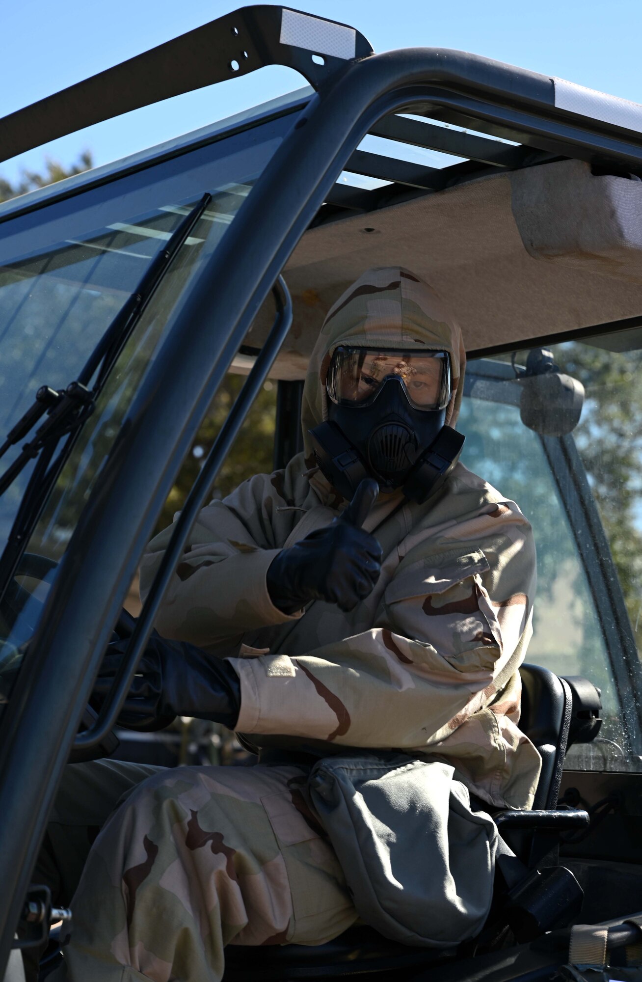 Airman gives directions in forklift