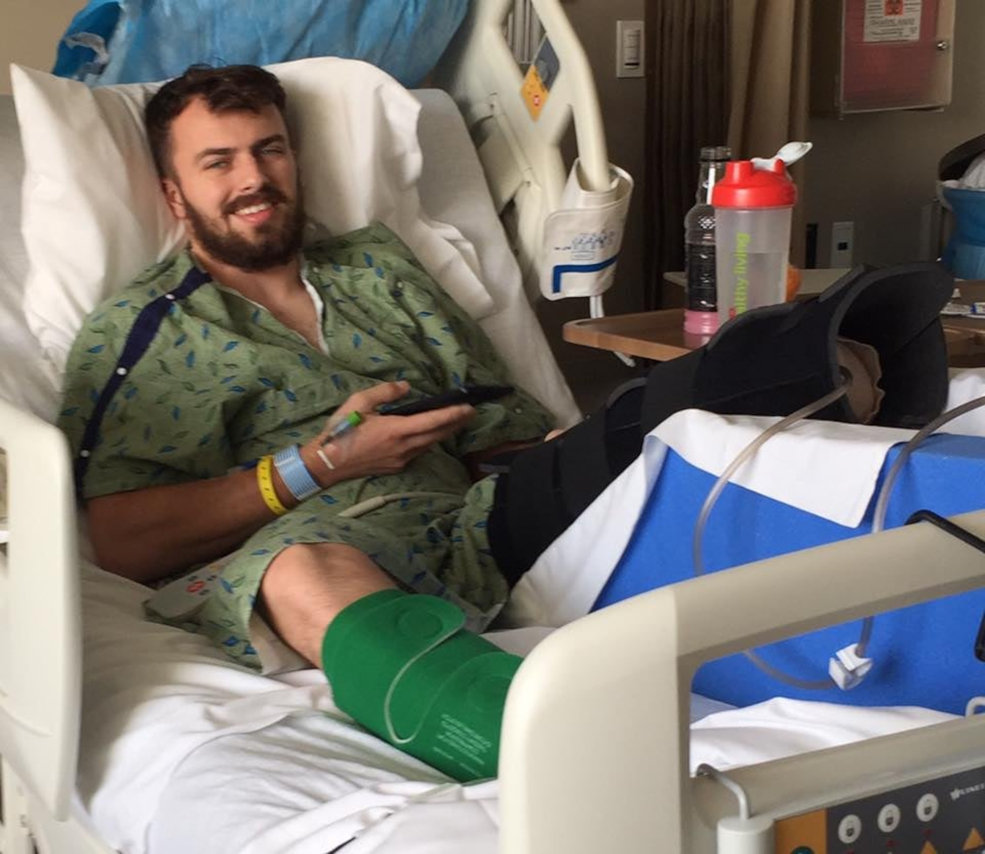Staff Sgt. Stuart Martin, 68th Airlift Squadron loadmaster, laying in a hospital bed between surgeries at the University Hospital in San Antonio after his left leg was amputated following a motorcycle accident in May 2017. (Courtesy photo)