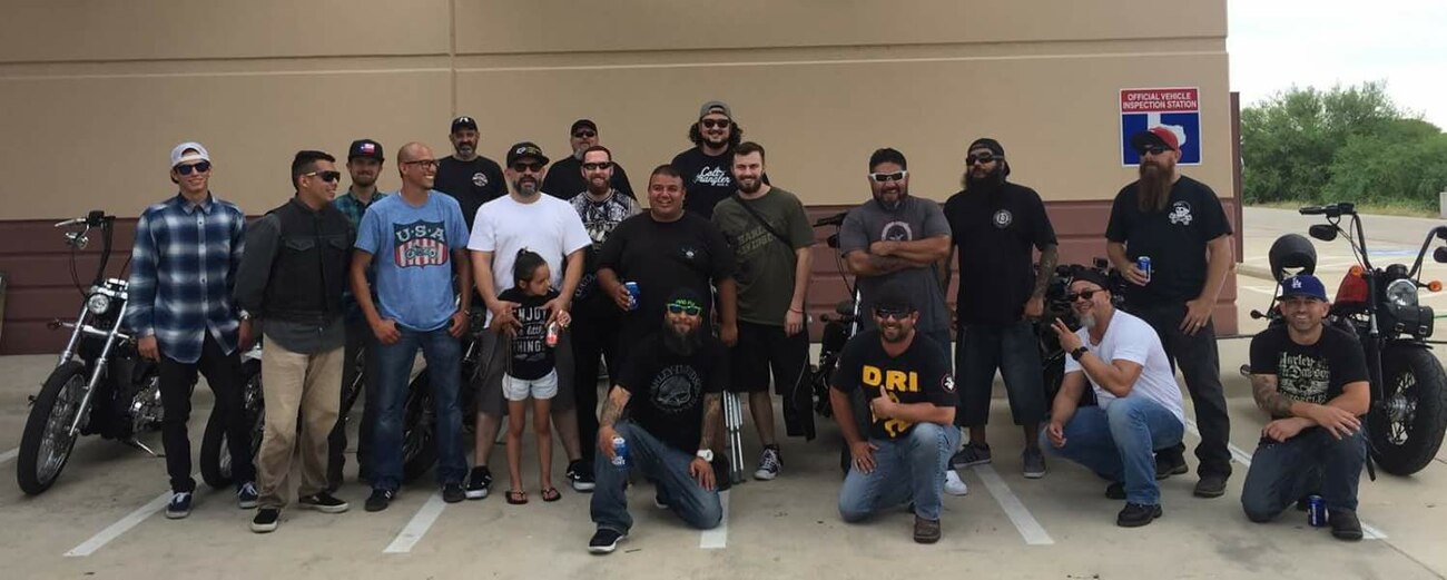 Staff Sgt. Stuart Martin, 68th Airlift Squadron loadmaster (center), surrounded by the motorcycle group that provided continued support and help after his motorcycle accident in May 2017. The group helped to raise funds for Martin’s medical expenses. (Courtesy photo)