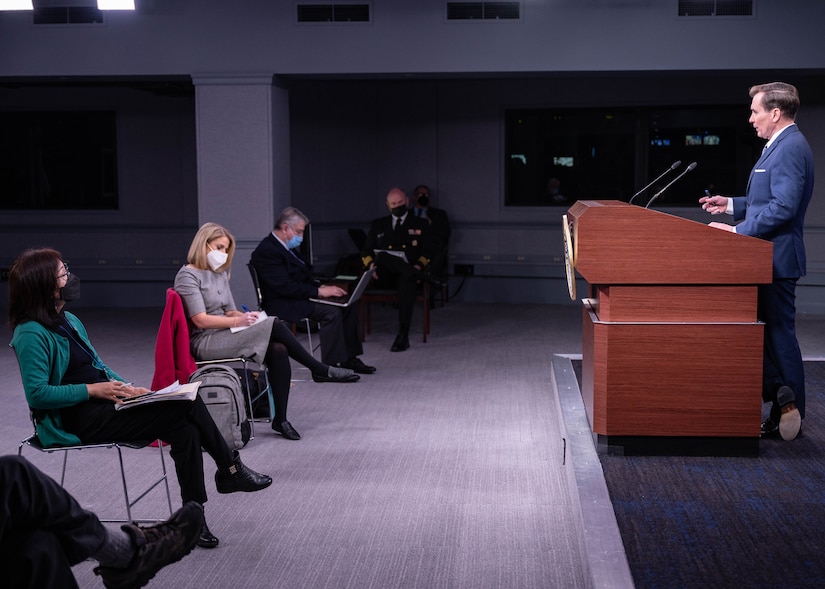 A man speaks to reporters at the Pentagon.