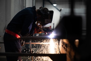 U.S. Air Force Senior Airman Samuel Zietzmann, a 354th Maintenance Squadron aircraft metals technology journeyman, uses plasma hard cutting to cut metal on Eielson Air Force Base, Alaska, Jan. 10, 2022.