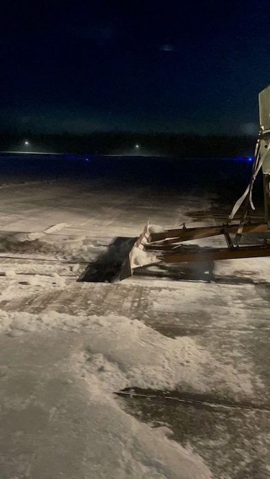 A 10K Forklift assigned to the 354th Logistics Readiness Squadron (LRS) utilizes the Flightling Ice Breaking Apparatus (FIBA) to scrape ice off the runway on Eielson Air Force Base, Alaska, Jan. 13, 2022.