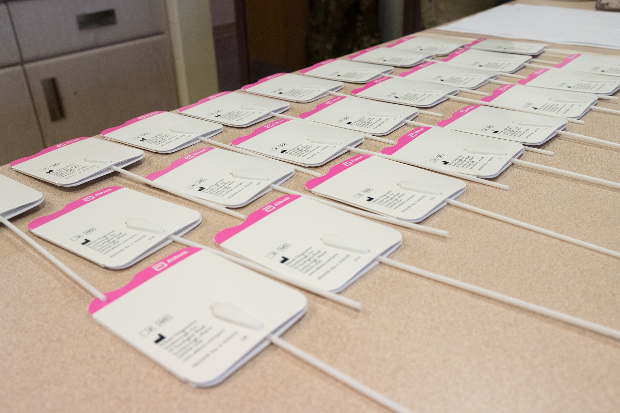 COVID-19 antigen tests are laid out on a table to process members results at Osan