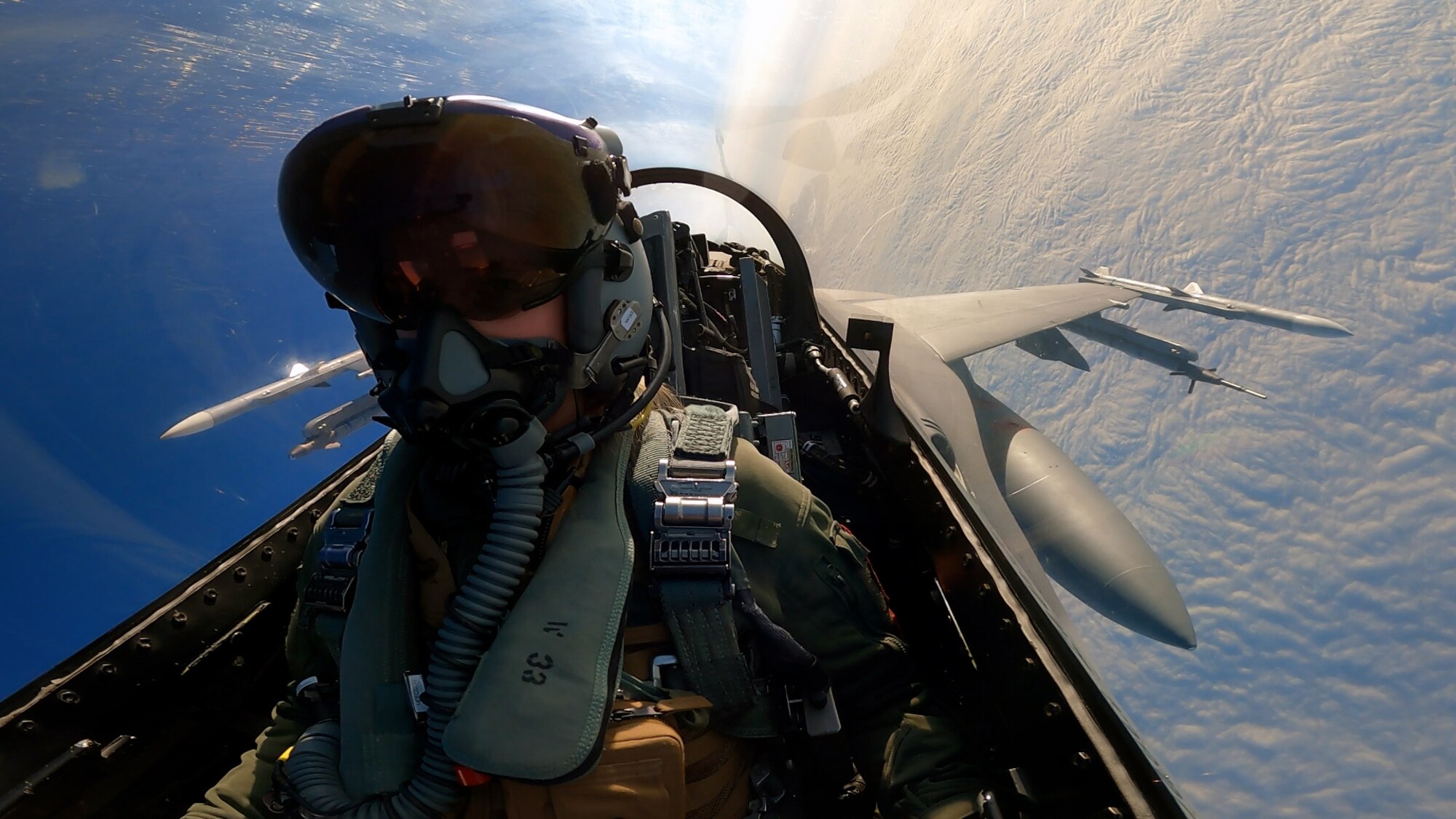 A U.S. Air Force F-16 Fighting Falcon pilot flies over Poland
