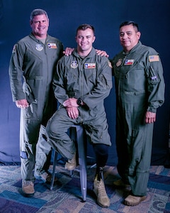 Staff Sgt. Stuart Martin, loadmaster (center), with his commander, Lt. Col. Daniel King (left), and his supervisor, Master Sgt. Michal Lopez, both with the 68th Airlift Squadron, Joint Base San Antonio-Lackland, Texas. King and Lopez were instrumental in Martin’s journey to return to flying status as a loadmaster on the C-5M super Galaxy following a motorcycle accident in May 2017. (U.S. Air Force Photo by Drew Patterson)