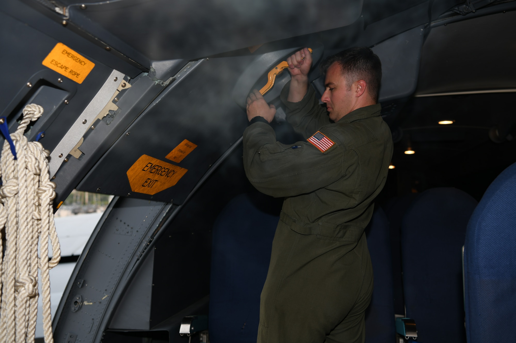 Staff Sgt. Stuart Martin, 68th Airlift Squadron loadmaster, closes a door in the troop compartment of a C-5M Super Galaxy aircraft Sept. 13, 2021, at Joint Base San Antonio-Lackland, Texas. Martin, who lost a leg in a motorcycle accident, was working to regain his loadmaster certifications and return to duty. (U.S. Air Force photo by Master Sgt. Kristian Carter)