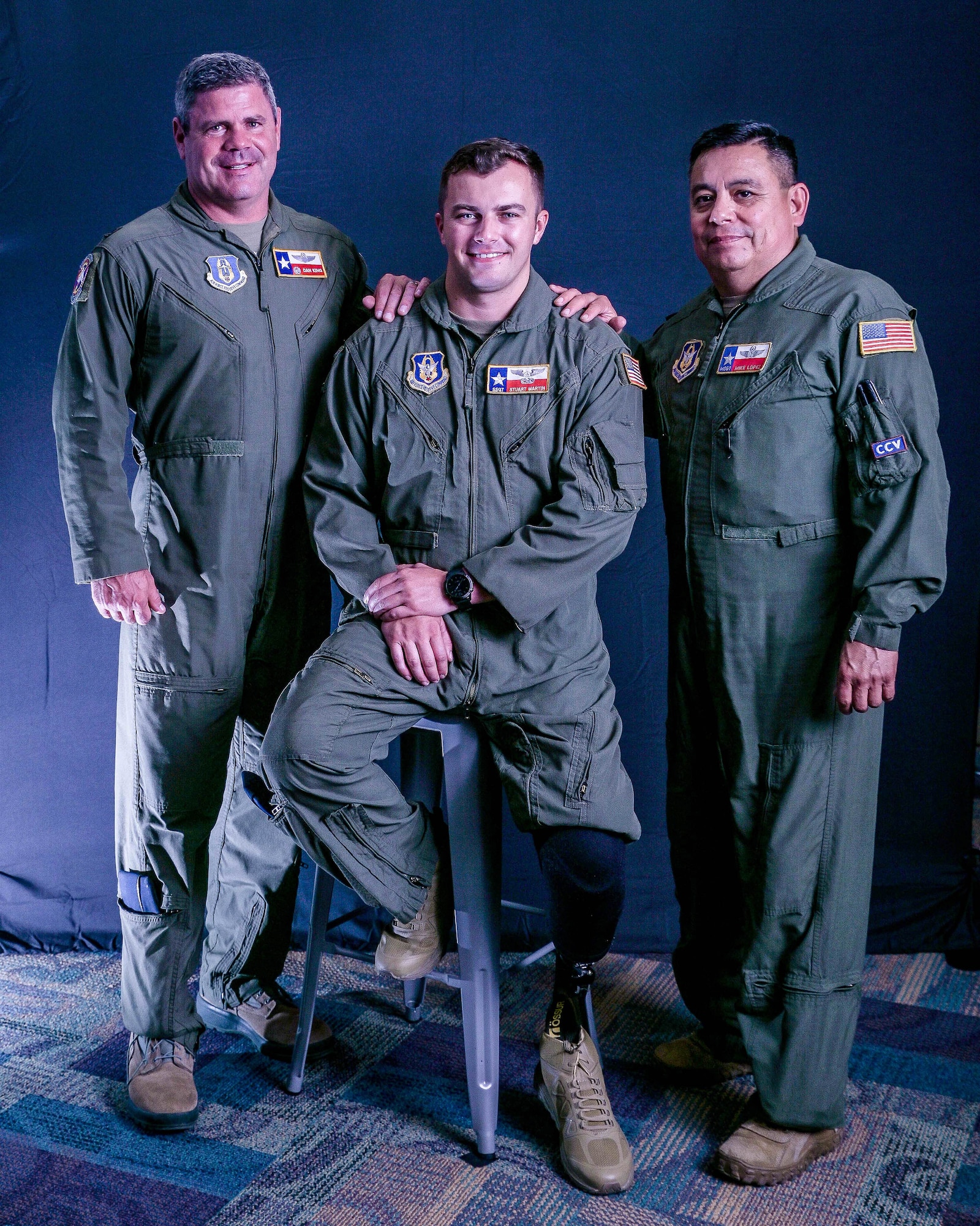 Staff Sgt. Stuart Martin, loadmaster (center), with his commander, Lt. Col. Daniel King (left), and his supervisor, Master Sgt. Michal Lopez, both with the 68th Airlift Squadron, Joint Base San Antonio-Lackland, Texas. King and Lopez were instrumental in Martin’s journey to return to flying status as a loadmaster on the C-5M super Galaxy following a motorcycle accident in May 2017. (U.S. Air Force Photo by Drew Patterson)