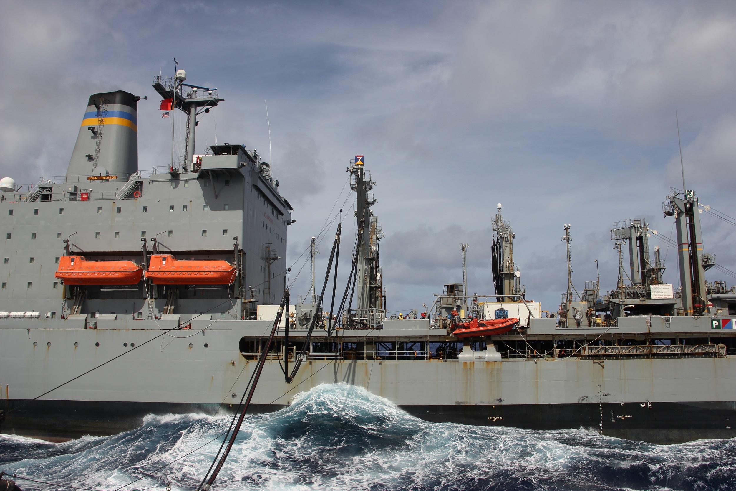USNS Jon Ericsson (T-AO 194) conducts a replenishment-at-sea with the Ticonderoga-class guided-missile cruiser USS Lake Champlain (CG 57).
