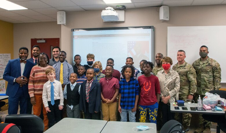 Brig. Gen. Jason Kelly (back row, third from right), commander for the U.S. Army Corps of Engineers South Atlantic Division, poses for a photo after speaking to Boys With A Purpose. Boys With A Purpose is after-school mentoring program and was created to inspire, influence and empower young men to focus on their life's purpose which will help them become productive and effective citizens in the world.