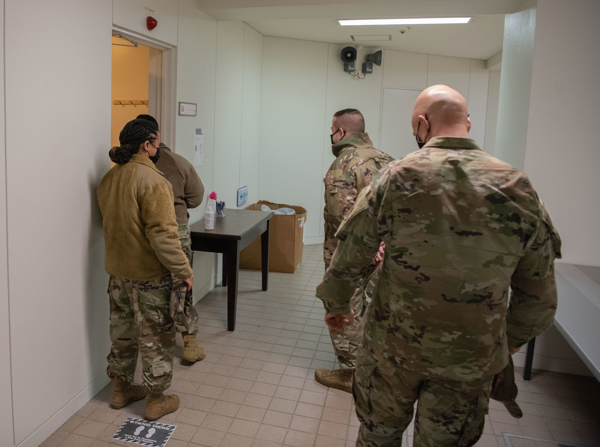 Members make their way into the contingency dorm's office.