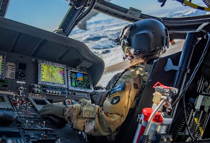 Chief Warrant Officer 2 Oceana Chamberlain practices flight maneuvers in Idaho’s snowy Owyhee Mountains south of Gowen Field in Boise, Idaho, Jan. 13, 2022. The Idaho National Guard replaced 20 of its UH-60L Black Hawk helicopters with UH-60M Black Hawks, a modernized and high-tech version aircraft.