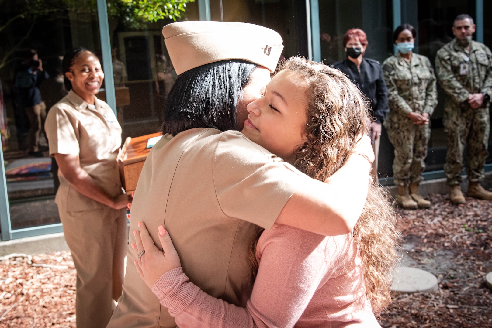 Abby and Natasha Gonzalez pin the rank of Navy Lieutenant upon their mother, Lizette Gonzalez, left, during her promotion ceremony Thursday, January 13 at Naval Health Clinic Cherry Point aboard Marine Corps Air Station Cherry Point. 
Gonzalez serves as the Clinic's Department Head for Human Resources.