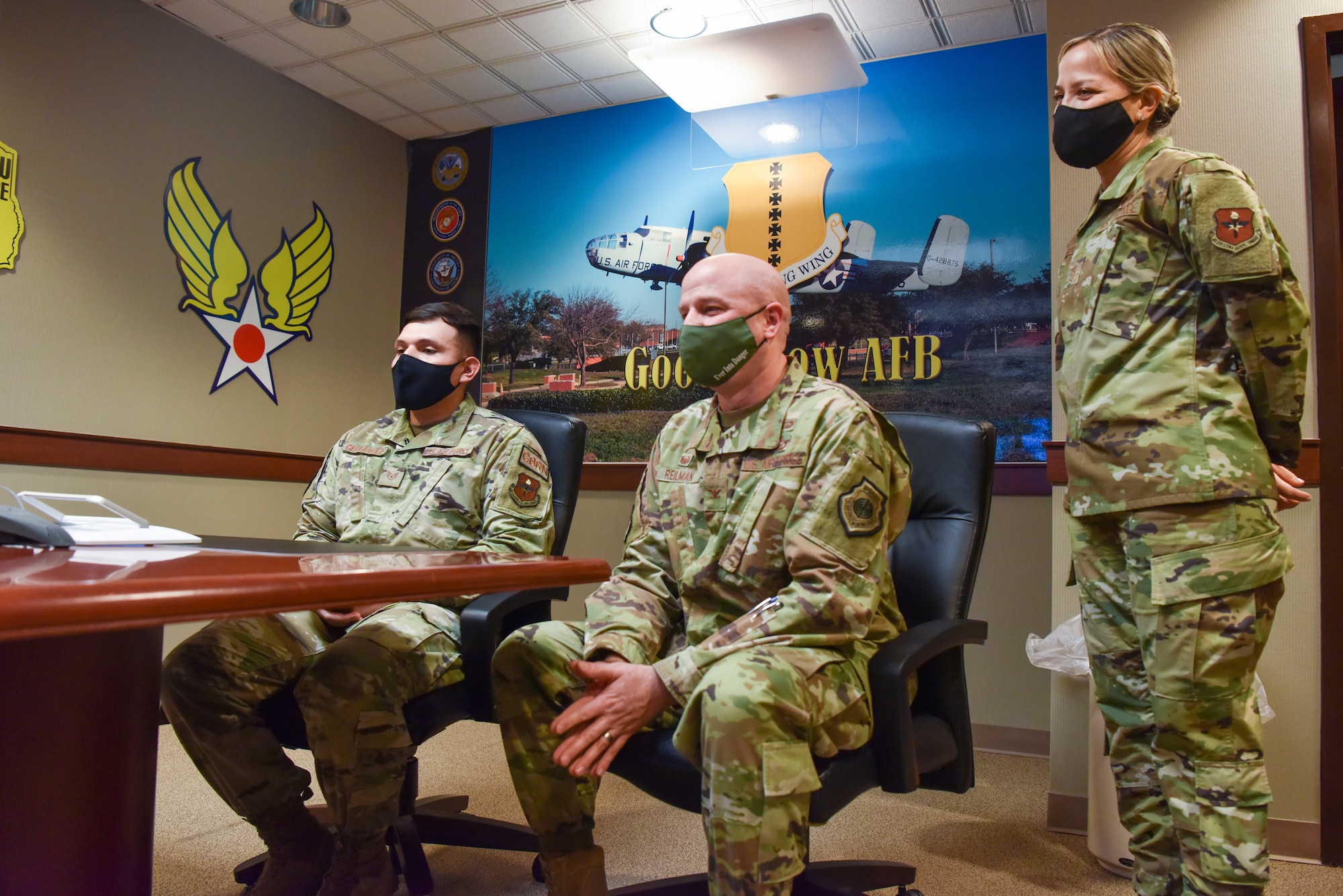 U.S. Air Force Staff Sgt. Samuel Cervantez, 17th Civil Engineer non-commissioned officer in charge of plans and operations for the Office of Emergency Management, Col. Matthew Reilman, 17th Training Wing commander and Chief Master Sgt. Rebecca Arbona, 17th TRW command chief, participate in a teleconference with  Secretary of the Air Force Frank Kendall, on Goodfellow Air Force Base, Texas, Jan. 11, 2022. Cervantez was selected for the Senior Leader Enlisted Commissioning Program, which will allow him to go to school for his bachelor’s degree while staying on active duty orders. (U.S. Air Force photo by Staff Sgt. Jermaine Ayers)