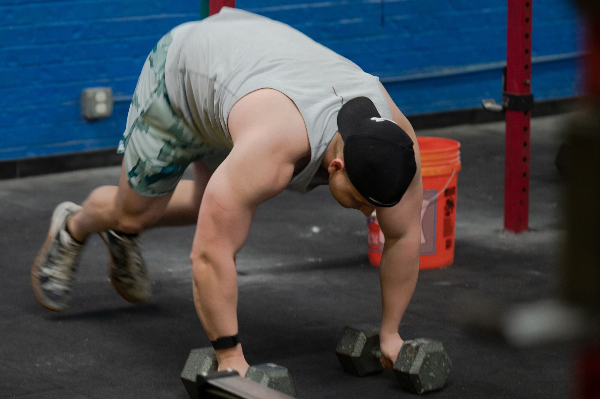 U.S. Air Force Master Sgt. Dalton Grainger, 316th Training Squadron instructor, performs a devil’s press at his local gym, San Angelo, Texas, January 12, 2022. Grainger keeps himself on a rotating fitness routine preparing for both his official fitness assessment and competition powerlifting. (U.S. Air Force photo by Senior Airman Michael Bowman)