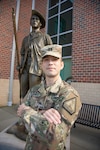 Capt. John C. Hemby poses for a photo at the Virginia National Guard’s Sgt. Bob Slaughter Headquarters at Defense Supply Center Richmond, Virginia. Hemby, a company commander with the VNG's Recruiting and Retention Battalion, provided immediate aid to three citizens in need over the course of 60 days. (U.S. Army National Guard photo by Staff Sgt. Lisa M. Sadler)