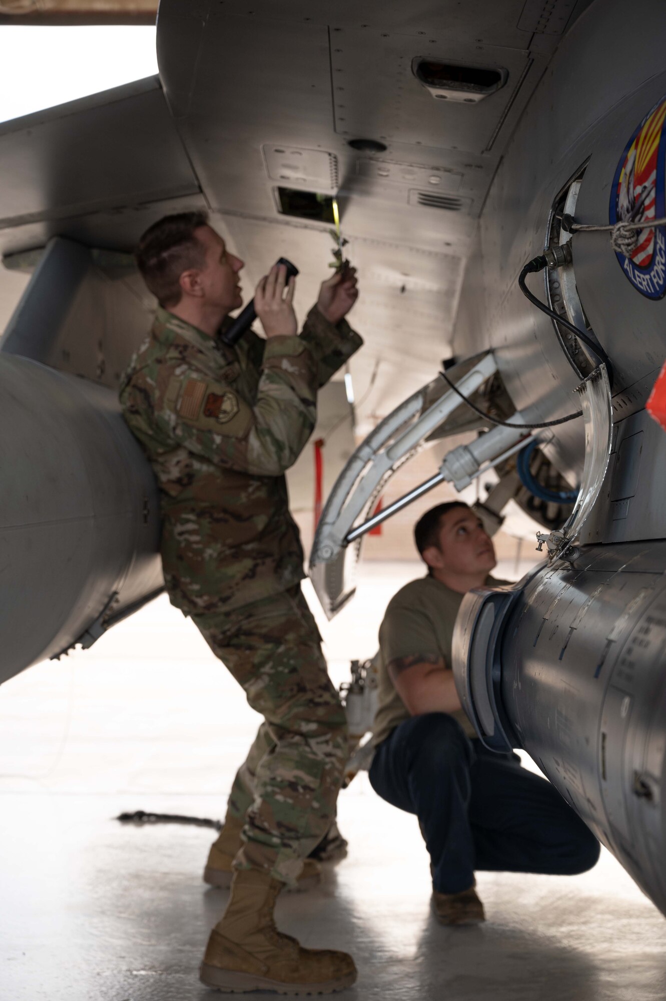 Airmen assigned to Detachment 2, 162nd Wing, inspect an F-16 alert jet for participation in a Western Air Defense Sector (WADS) exercise, dubbed Exercise Felix Hawk, over Southern Arizona on Jan. 18.