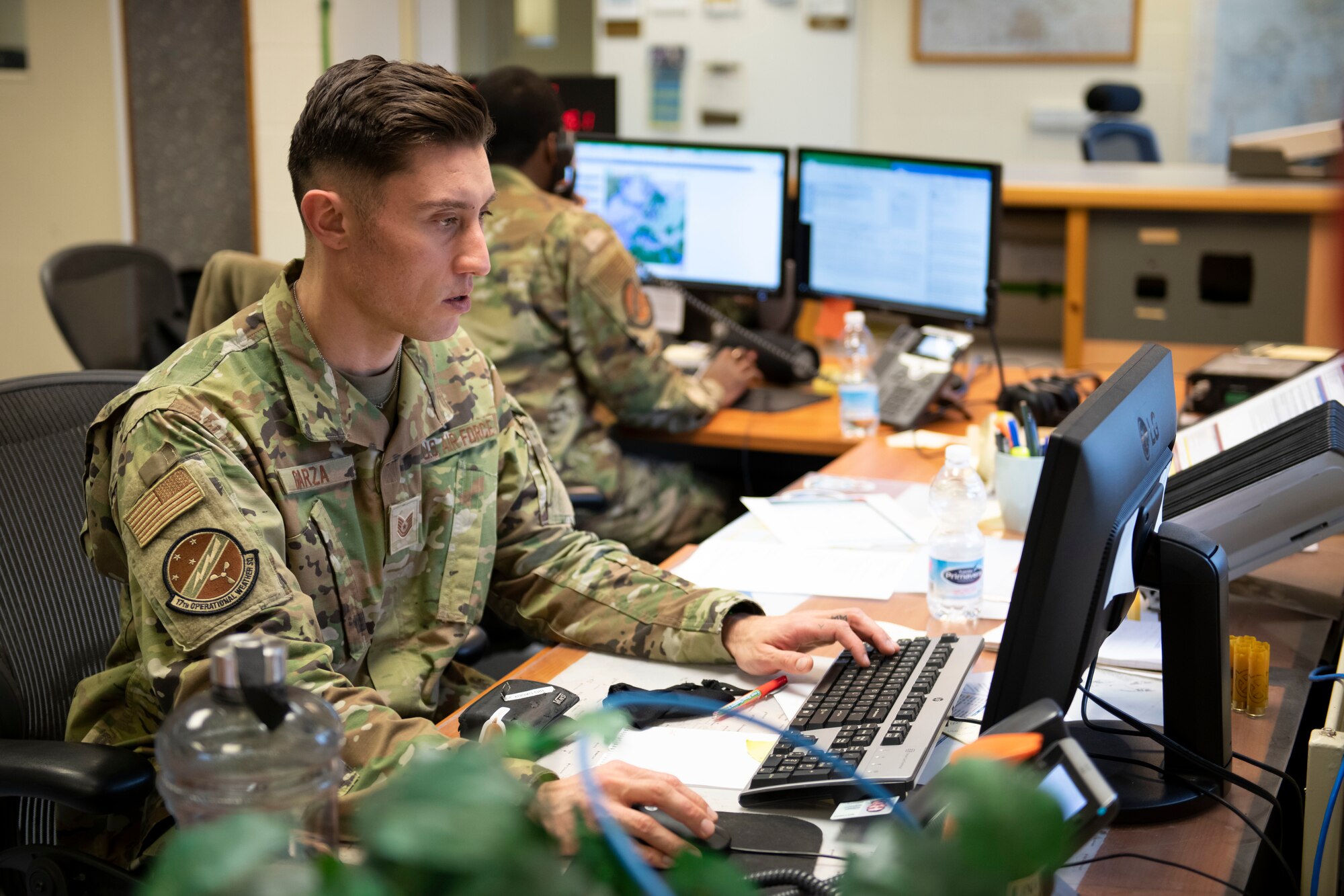 U.S. Air Force Tech Sgt. Joseph Garza, 420th Expeditionary Air Base Squadron noncommissioned officer in charge of weather flight, prepares a weather report at Royal Air Force Fairford, England, Jan. 11, 2022. Members of the 420th EABS, deployed from around the world, work  together with the 420th Air Base Squadron to support various missions at Fairford. From Jan. 8-12, the 420th EABS provided support for the 352nd Special Operations Wing’s Agile Combat Employment exercise. ACE exercises prepare Airmen to operate effectively from locations with varying levels of capacity and support. (U.S. Air Force photo by Senior Airman Jennifer Zima)