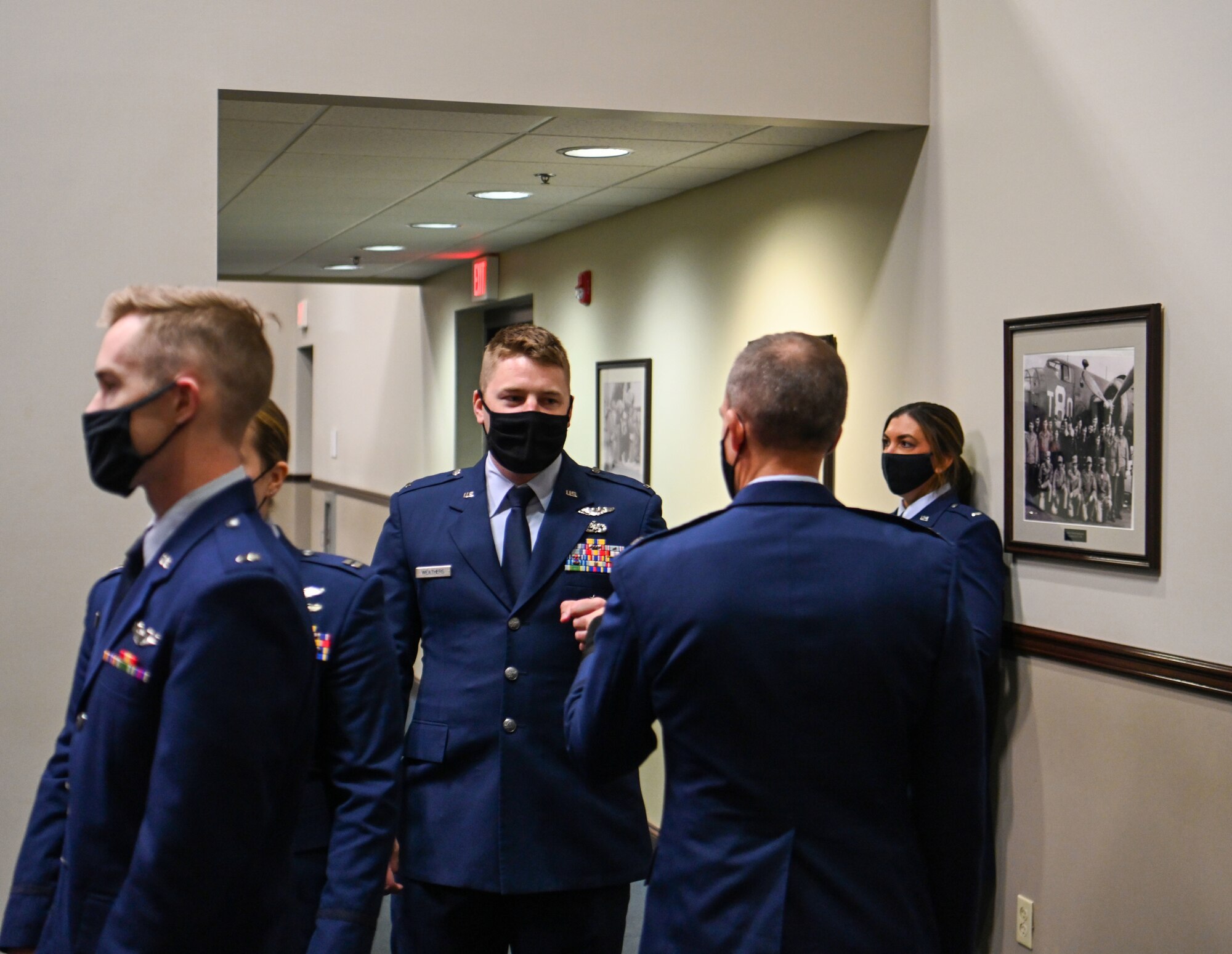 Col. Justin Spears, 14th Operation Group commander, fist bumps a graduate of Specialized Undergraduate Pilot Training Class 22-04 on Jan. 14, 2022, at Columbus Air Force Base, Miss. The 14th OG conducts pilot training and Introduction to Fighter Fundamentals for more than 400 U.S. Air Force and international officers each year, using a fleet of 233 T-6A, T-38C and T-1A aircraft and 27 flight simulators at Columbus AFB. (U.S. Air Force photo by Senior Airman Davis Donaldson)