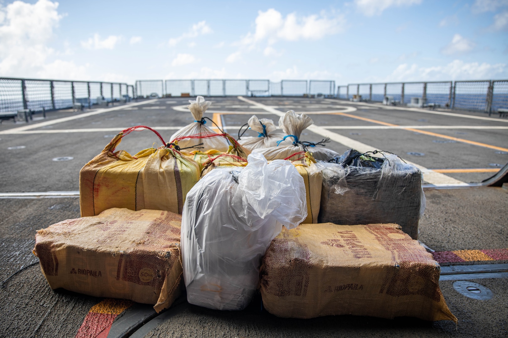 Approximately 315 kilograms of suspected cocaine sits on the flight deck of  USS Milwaukee.