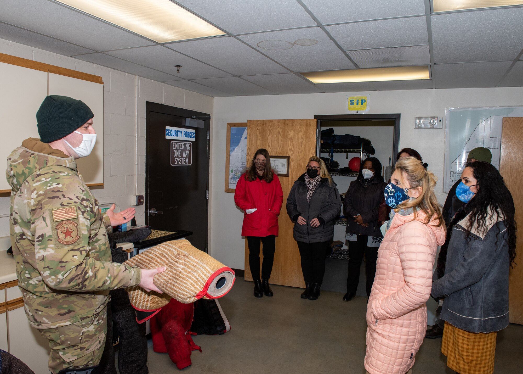 The 673d Security Forces Squadron Military Working Dog trainer supervisor speaks to PACAF key spouses.