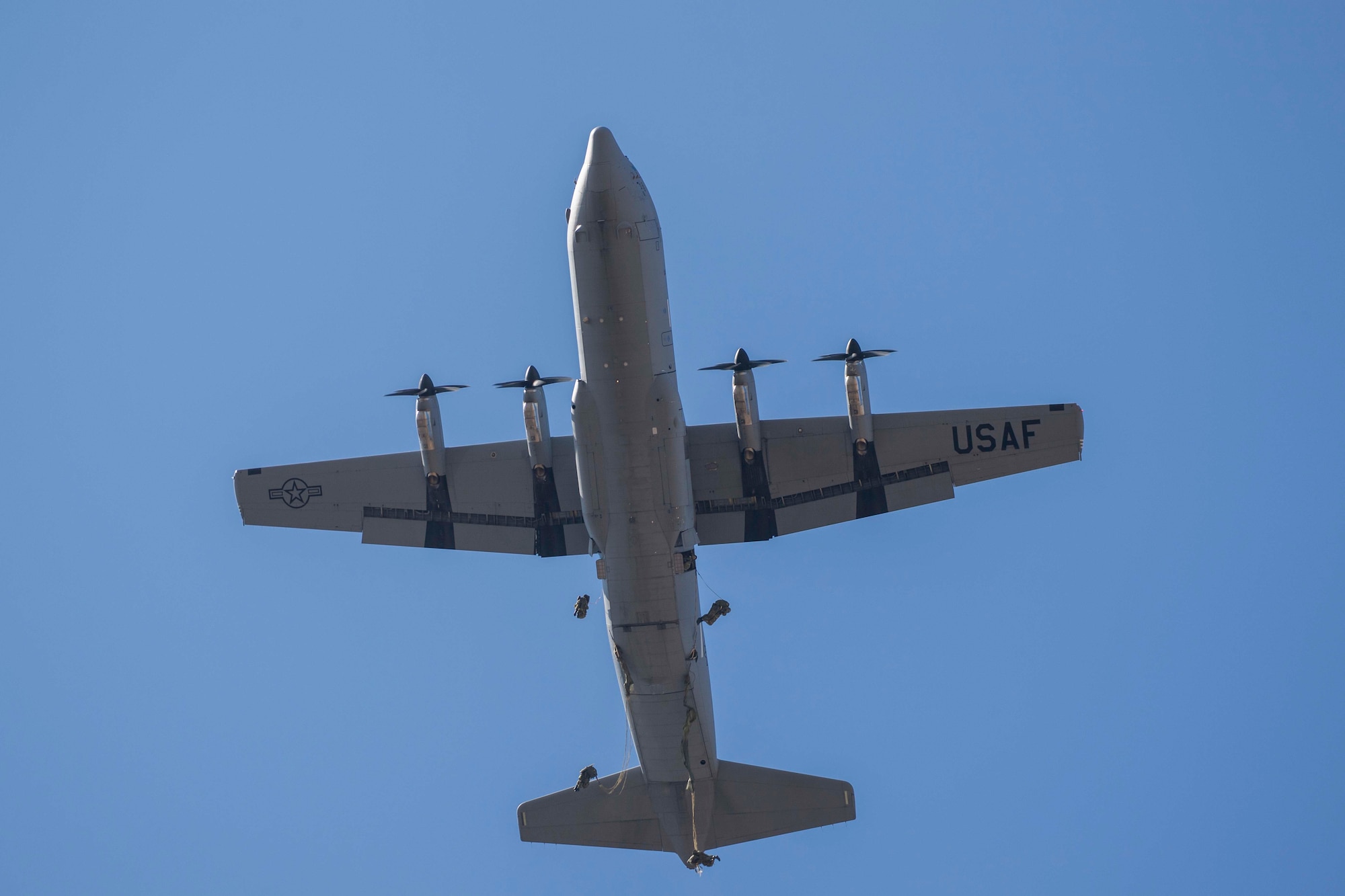 Japanese paratroopers jump from a C-130J Hercules aircraft