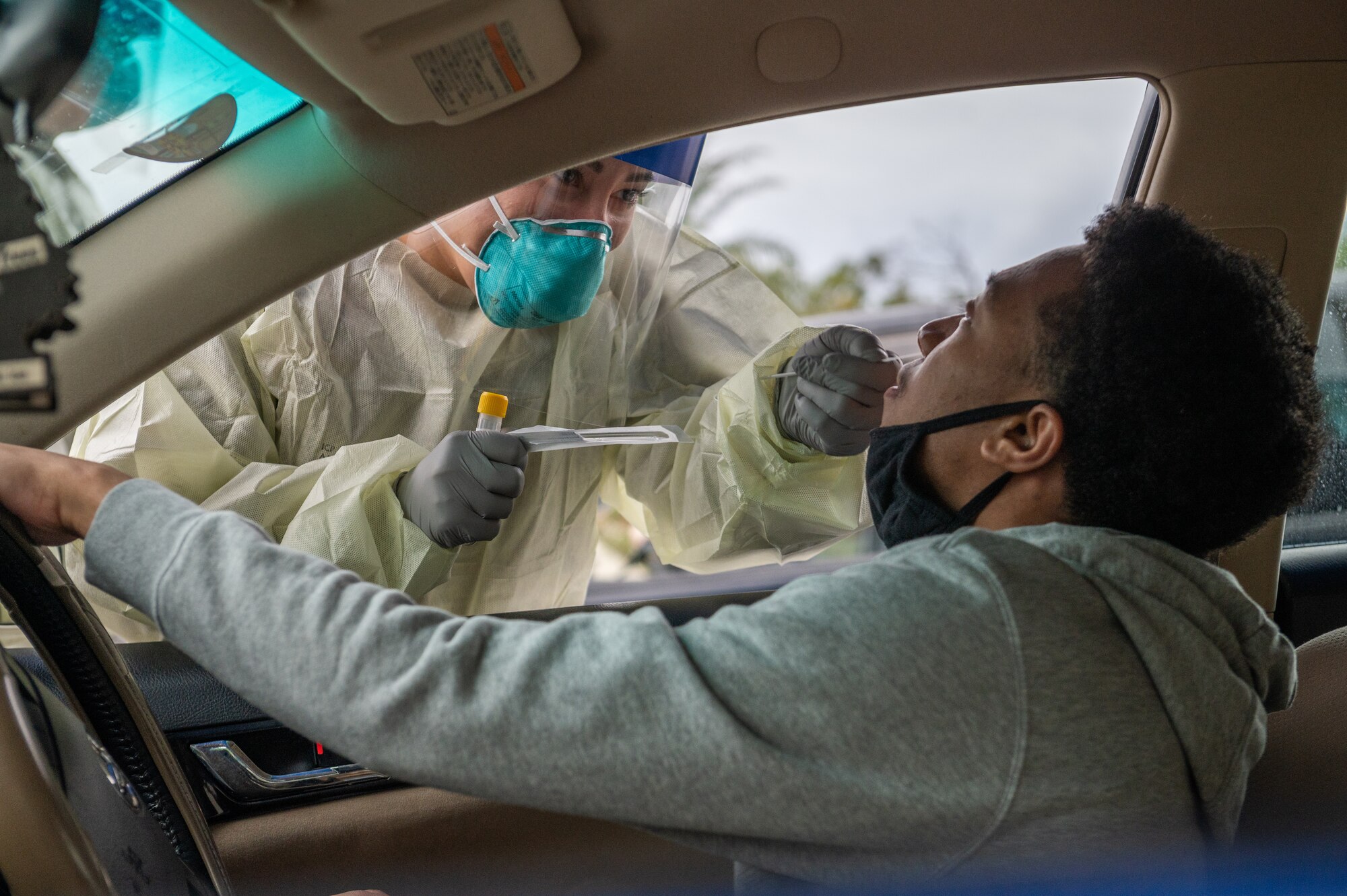 Airman performing a COVID-19 test