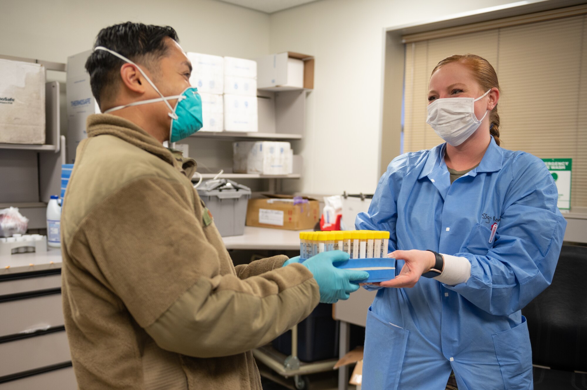 Airmen holding test samples