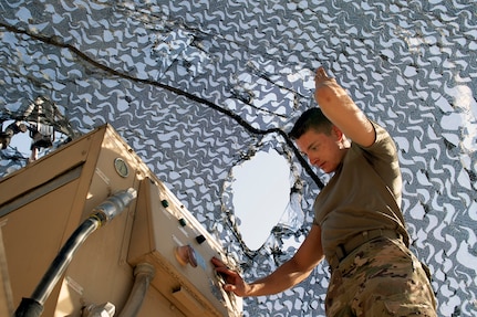 U.S. Army Spc. Corbin Doll, a forward observer with 1st Battalion, 194th Field Artillery, mans a Counter-Rocket, Artillery, Mortar gun at Al Asad Air Base, Iraq, on June 7, 2021. As a forward observer, Doll has been trained to help direct artillery and mortar fire. (U.S. Army National Guard photo by Sgt. 1st Class Christie R. Smith)