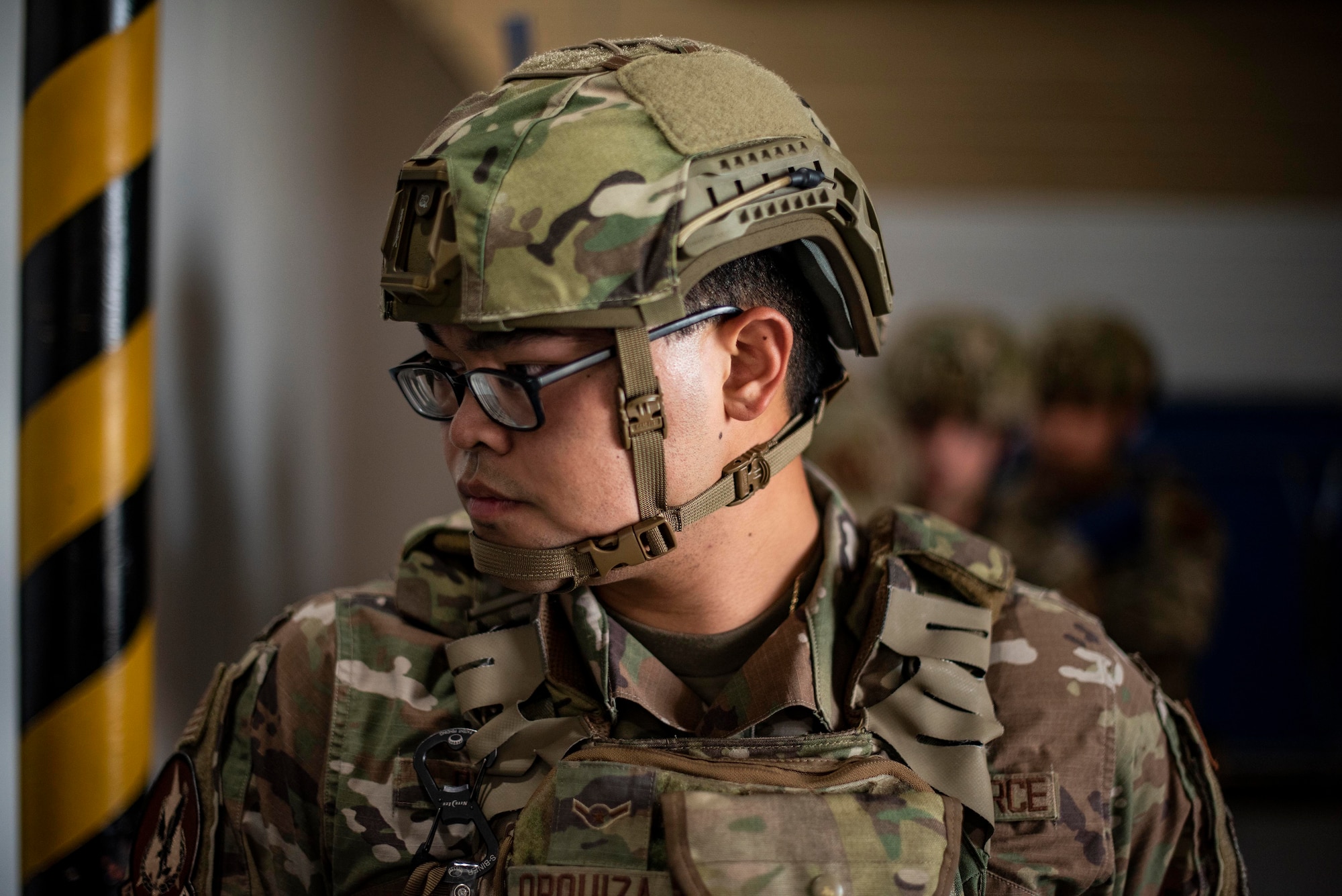 Airman Alex Orquiza, 71st Security Forces Squadron, wears a next generation ballistic helmet during a door-breaching exercise at Vance Air Force Base, Oklahoma, Sept. 15, 2020. The Air Force Security Forces Center at JBSA-Lackland, Texas, has delivered more than 27,000 helmets to security forces units as part of its effort to standardize and modernize Defender equipment across the Total Force. (U.S. Air Force photo by Senior Airman Taylor Crul)