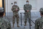 Brig. Gen. Jack Davis and CMDCM Trey Hauptman speak to Army and Navy personnel after morning colors.