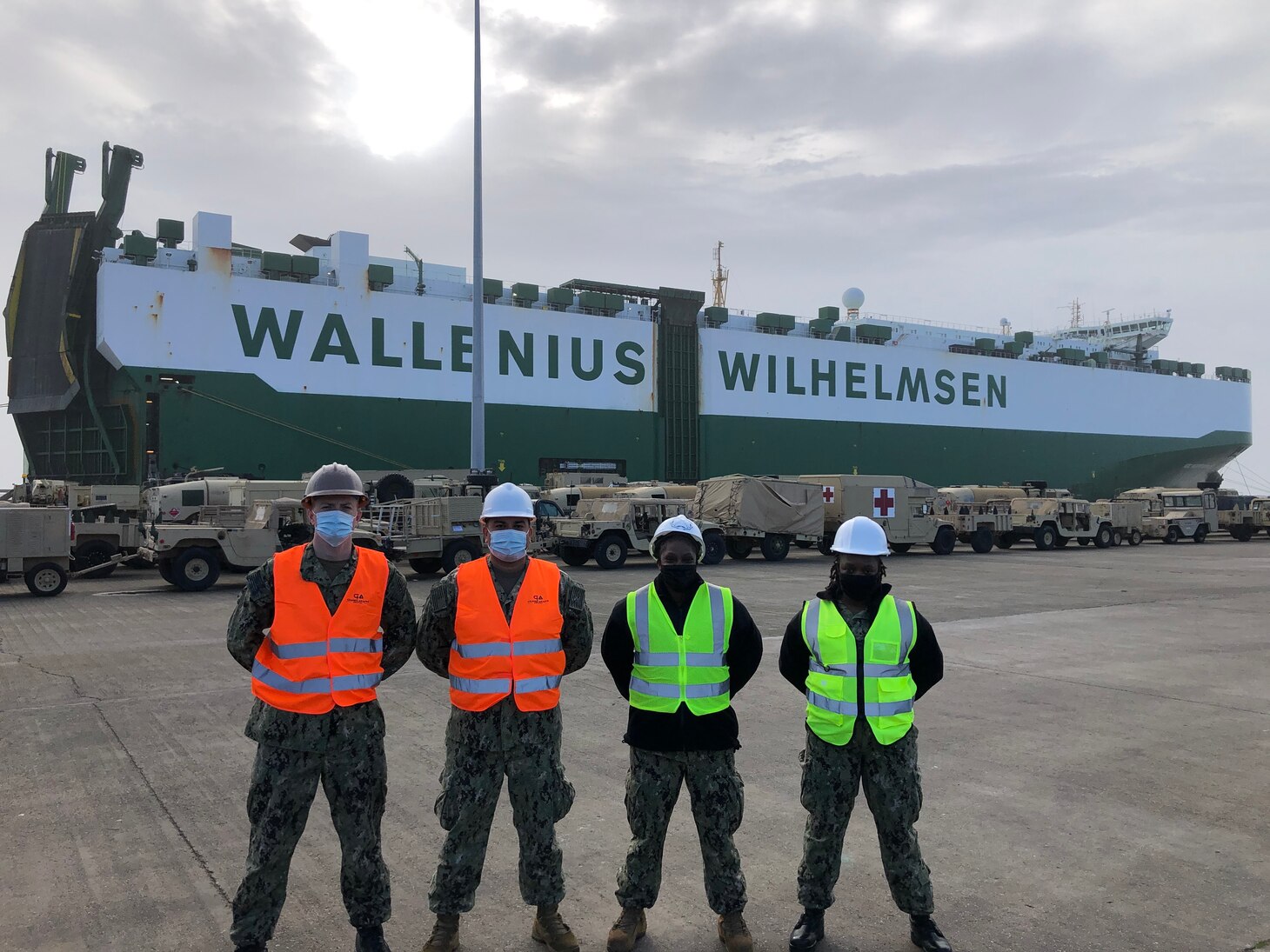 Members of Military Sealift Command's Expeditionary Port Units 104 and 106 stand by U.S. Army materiel transported by MSC's time-charted motor vessel ARC Independence at the Port of Alexandroupolis, Greece in late 2021.