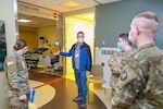 Oregon Army National Guard members tour West Valley Hospital in Dallas, Oregon, Jan. 18, 2022, as part of the team's orientation. About 1,200 Guard members are serving in non-clinical roles at as many as 40 hospitals facing a surge of COVID-19 patients.