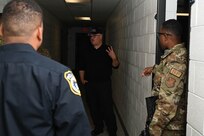 Sgt. Lance LaRue, 11th Security Forces Squadron member and police trainer assigned to Joint Base Anacostia-Bolling, instructs 11th SFS Defenders and civilian members during a training event at the Metropolitan Police Academy, Washington, D.C., Nov. 24, 2021. During the training, participants conducted building searches, room clearing and tactical team movements. Participating in these training opportunities prepares the JBAB team to enable joint, interagency and community missions. (U.S. Air Force photo by Airman 1st Class Anna Smith)