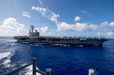 The navy’s only forward deployed aircraft carrier USS Ronald Reagan (CVN 76) comes alongside to prepare for a refueling-at-sea with the Ticonderoga-class guided-missile cruiser USS Shiloh (CG-67), Sept. 28, 2021. Shiloh is attached to Commander, Task Force 70/Carrier Strike Group 5 conducting underway operations in support of a free and open Indo-Pacific. (U.S. Navy Photo by Mass Communication Specialist 1st Class Rawad Madanat)