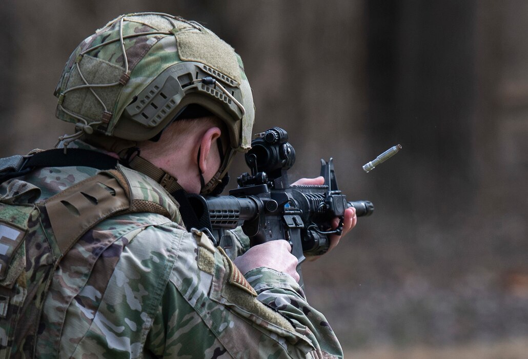 A member of the 88th Security Forces Squadron fires a simunition round at a fixed target with an M4 carbine rifle during sustainment training at Wright-Patterson Air Force Base, Ohio, March 17, 2021. Training such as this is required twice a year for Security Forces members to maintain their weapons certifications (U.S. Air Force photo by Wesley Farnsworth)