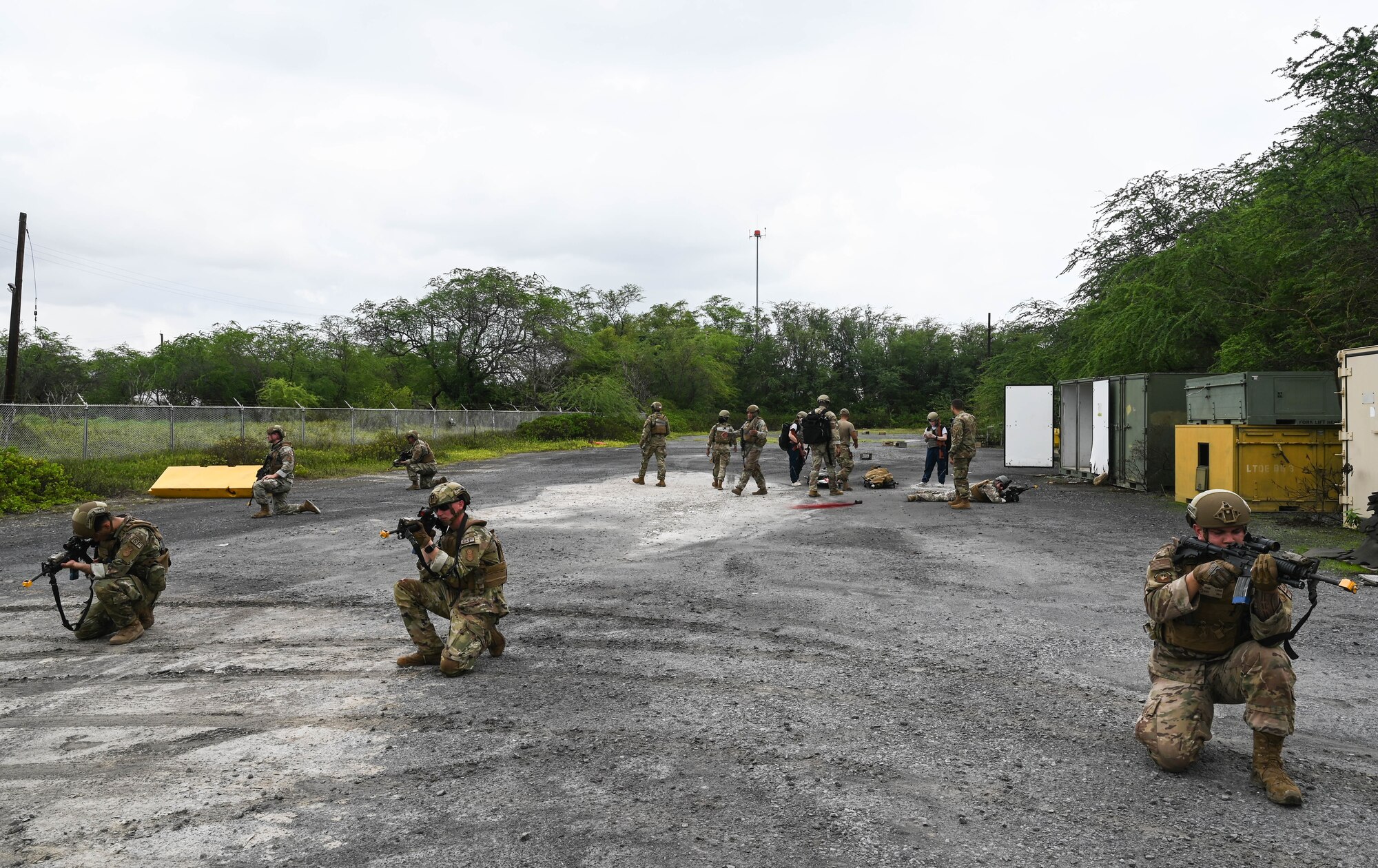Airmen assigned to the 647th Security Forces Squadron form a circle around a simulated extraction point during a joint field training exercise with the 15th Medical Group at Joint Base Pearl Harbor-Hickam, Hawaii, Jan. 12, 2022. A total of 37 Airmen participated in the joint training in order to fulfill readiness training required by the Department of Defense. (U.S. Air Force photo by Staff Sgt. Alan Ricker)