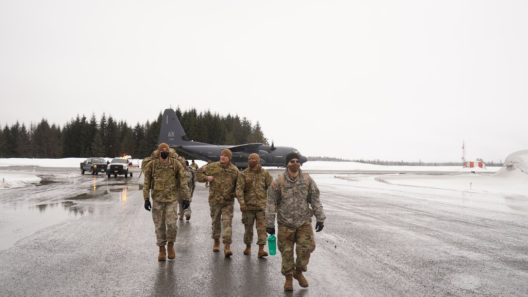 Alaska National Guard Soldiers and Airmen arrive in the Southeast Alaska community of Yakutat, Jan. 12, 2022, after the region received tremendous amounts of snow and rain over a seven-day period. Guard members serving on Joint Task Force-Yakutat will provide building safety assessments and emergency snow removal for Tribal, public and government facilities in the community following hazardous winter weather and heavy snowfall resulting in building damage and continued risk of unsafe conditions. Yakutat is in the Tongass National Forest, the largest National Forest in the U.S. and home to the largest population of bald eagles in the world. The Alaska National Guard is trained, equipped and ready to provide disaster response support for the State of Alaska when requested by civil authorities. (U.S. Army National Guard photo by Dana Rosso)