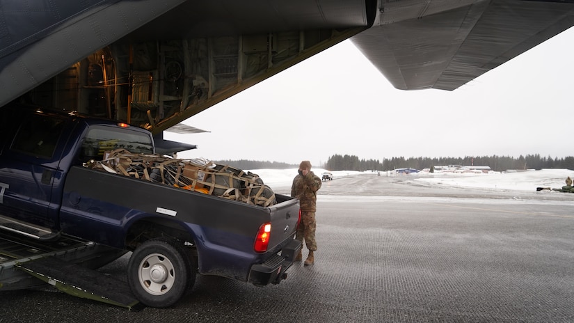 Alaska National Guard Soldiers and Airmen arrive in the Southeast Alaska community of Yakutat, Jan. 12, 2022, after the region received tremendous amounts of snow and rain over a seven-day period. Guard members serving on Joint Task Force-Yakutat will provide building safety assessments and emergency snow removal for Tribal, public and government facilities in the community following hazardous winter weather and heavy snowfall resulting in building damage and continued risk of unsafe conditions. Yakutat is in the Tongass National Forest, the largest National Forest in the U.S. and home to the largest population of bald eagles in the world. The Alaska National Guard is trained, equipped and ready to provide disaster response support for the State of Alaska when requested by civil authorities. (U.S. Army National Guard photo by Dana Rosso)